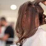 Shallow Focus Photo of Person Fixing Hair